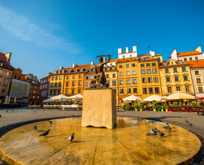 Market square with fountain on a beautiful sunny morning in Warsaw, Poland